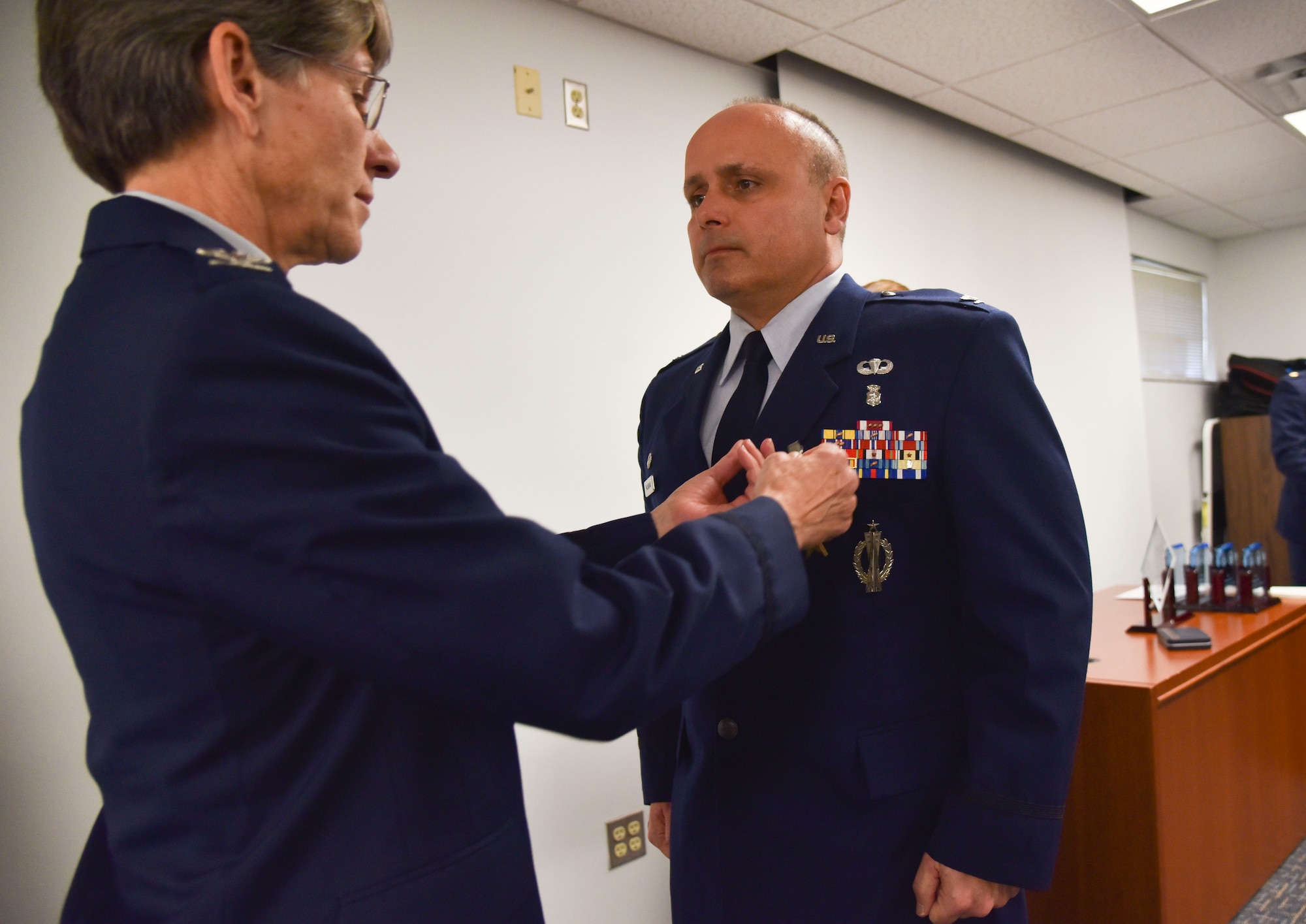 Col. James Palmisano, commander, 45th Aeromedical Evacuation Squadron, MacDill Air Force Base, Florida, was presented the Bronze Star by Col. Caroline Evernham, commander, 927th Operations Group, during a ceremony held here, 7 Jan., for actions while on deployment to Bagram Airfield, Afghanistan. (U.S. air force photo by Tech. Sgt. Adam Borgman)