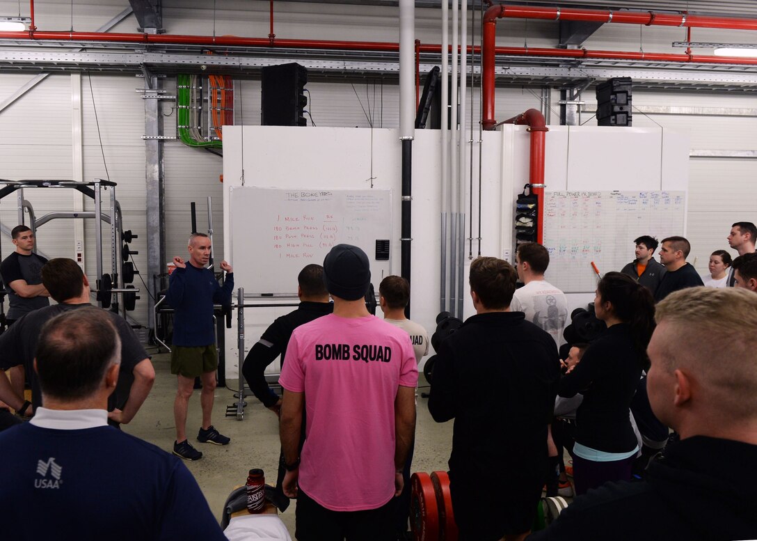 Maj. John Sullivan, 435th Security Forces Squadron commander, briefs Airmen attending an Explosive Ordinance Disposal Fallen Warrior Workout on the specifics of the event on Ramstein Air Base, Germany, Jan 5, 2018. For the workout, three-person teams were to complete a 1-mile run, 180 reps of bench-press, 180 reps of push-press, 180 reps of high-pull, and a final 1-mile run. (U.S. Air Force photo by Senior Airman Jimmie D. Pike)