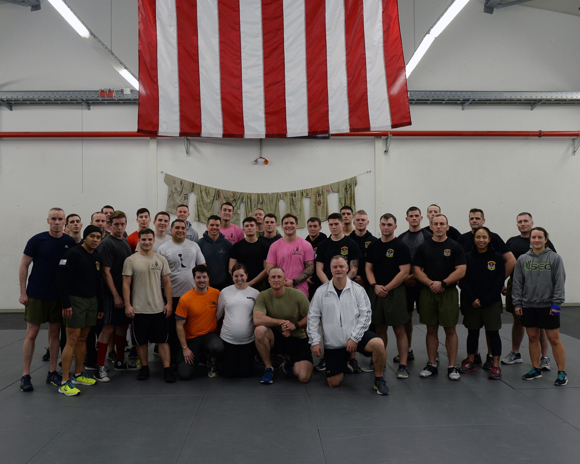 Airmen who participated in an Explosive Ordinance Disposal Fallen Warrior Workout pose for a photo on Ramstein Air Base, Germany, Jan. 5, 2018. Thirty-six Airmen from multiple units completed the workout to honor and remember fallen EOD Airmen; Tech. Sgt. Matthew Schwartz, Senior Airman Bryan Bell, and Airman 1st Class Matthew Seidler - call sign "Tripwire". (U.S. Air Force photo by Senior Airman Jimmie D. Pike)