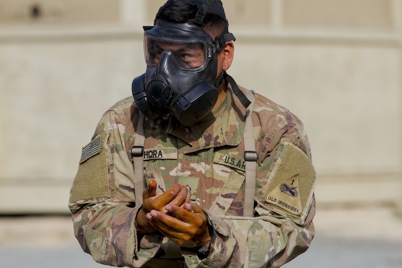 Soldier with a gas mask on.