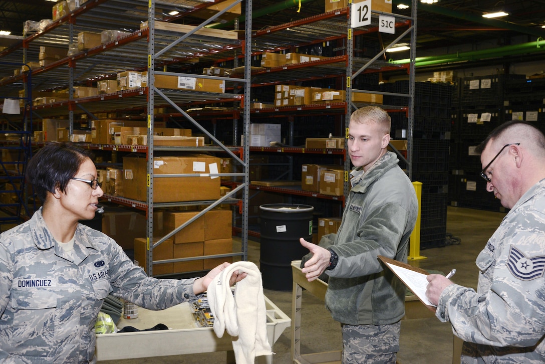 Guardsmen pass out cold weather gear.