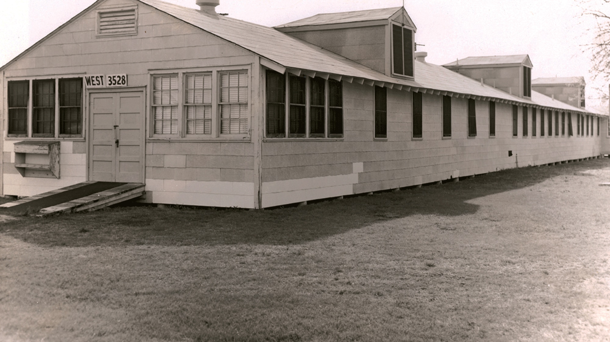 Typical example of the cantonment-style buildings used as hospitals at Lackland Air Force Base prior to the construction of Wilford Hall Medical Center in 1957. Building 3528 was located on the east side of 14th St. (now Ladd St.), north of Ave E (now Kenley Ave), and was also known as Ward A14. (Courtesy photo)