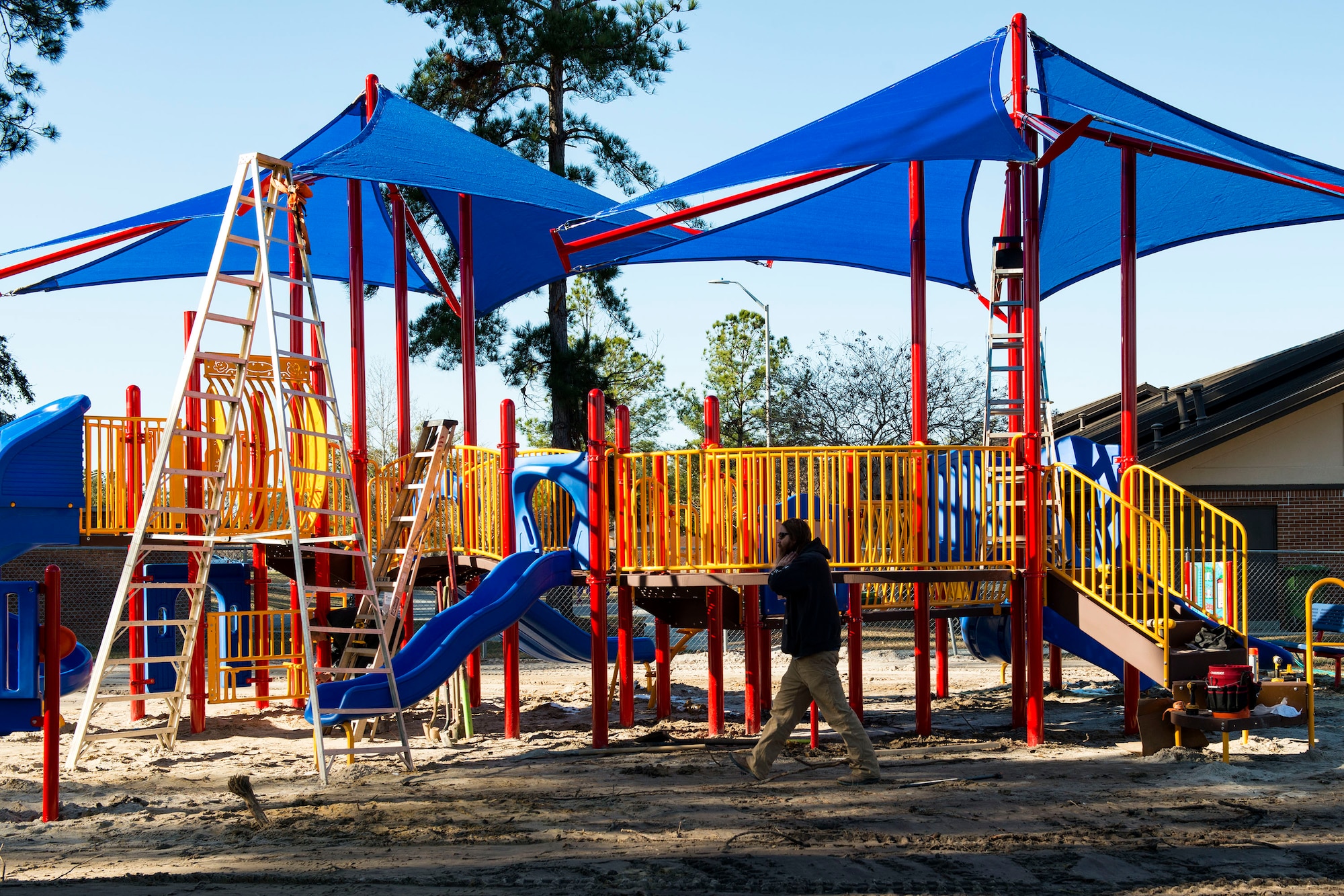 Professional playground installers construct a new playground, Jan. 4, 2018, at Moody Air Force Base, Ga. The 23d Force Support Squadron rebuilt and designed the new playground to improve quality of life and safety for Team Moody families. (U.S. Air Force photo by Airman 1st Class Erick Requadt)