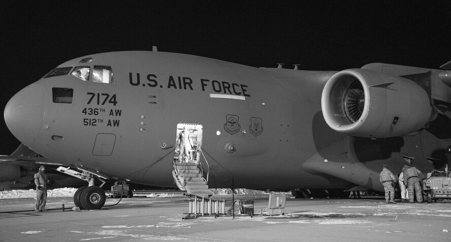 Maintenance personnel from the 736th Aircraft Maintenance Squadron prepare to launch a C-17A Globemaster III, Jan. 5, 2018, at Dover Air Force Base, Del. The maintainers prepared the aircraft for a mission in temperatures in the low teens with a wind chill hovering around minus three degrees. (U.S. Air Force photo by Roland Balik)