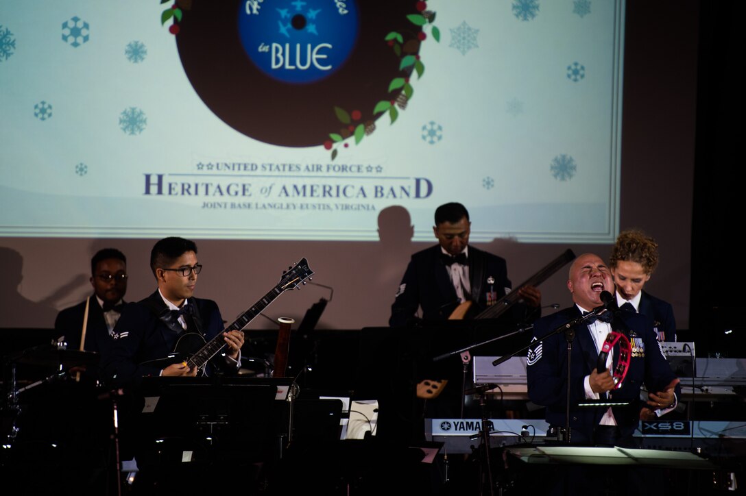 The U.S. Air Force Full Spectrum band performs a holiday song during the Holiday Memories in Blue concert at Tabb High School in Yorktown, Va., Dec. 6, 2017.