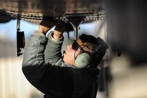 Senior Airman Carlos Ramon-Cruz, 75th Aircraft Maintenance Unit crew chief, tightens a screw on an A-10C Thunderbolt II, Jan. 5, 2018, at Moody Air Force Base, Ga. Team Moody resumed its flying operations after a Jan. 3 snow storm halted all maintenance and flying operations. (U.S. Air Force photo by Airman Eugene Oliver)