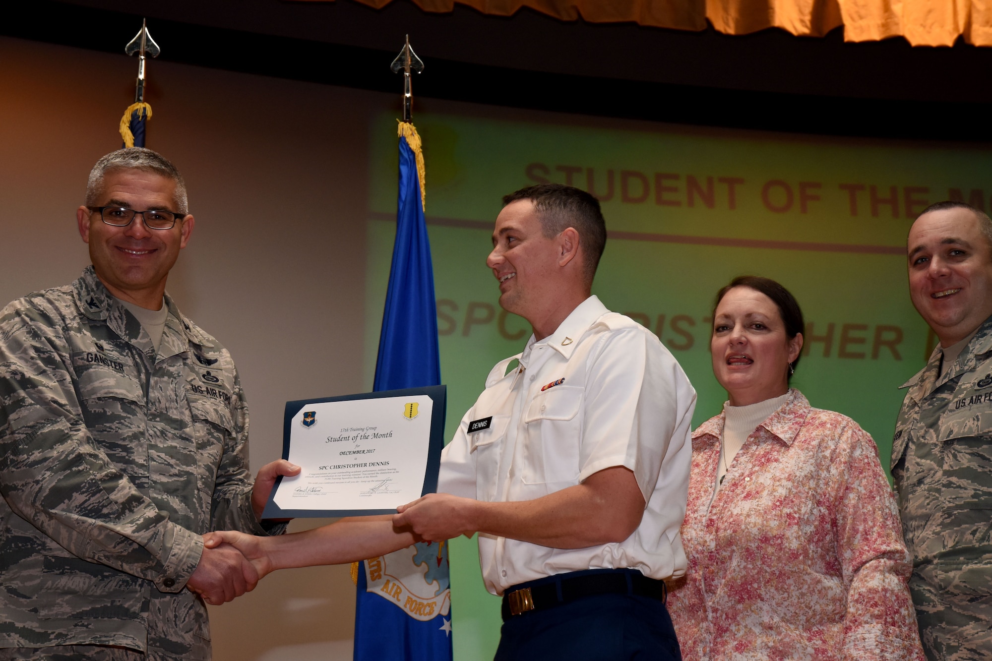 U.S. Air Force Col. Alex Ganster, 17th Training Group commander, presents the 312th Training Squadron Student of the Month award for Dec. 2017 to U.S. Army Spc. Christopher Dennis, 312th TRS trainee, in the base theater on Goodfellow Air Force Base, Texas, Jan. 5, 2018. The 312th Training Squadron’s mission is to provide Department of Defense and international customers with mission ready fire protection and special instruments graduates and provide mission support for the Air Force Technical Applications Center. (U.S. Air Force photo by Airman 1st Class Seraiah Hines/Released)