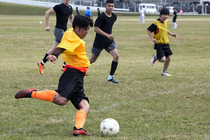 Hideto Gushiken attempts to make a goal at a six-on-six soccer tournament Jan. 6 aboard Camp Hansen, Okinawa, Japan. Marine Corps Community Services invited members of the local community to compete against Marines for the first place trophy. Gushiken, a member of Schwab Football Club, is an Army and Air Force Exchange Service employee aboard Camp Schwab.  (U.S. Marine Corps photo by Pfc. Nicole Rogge)
