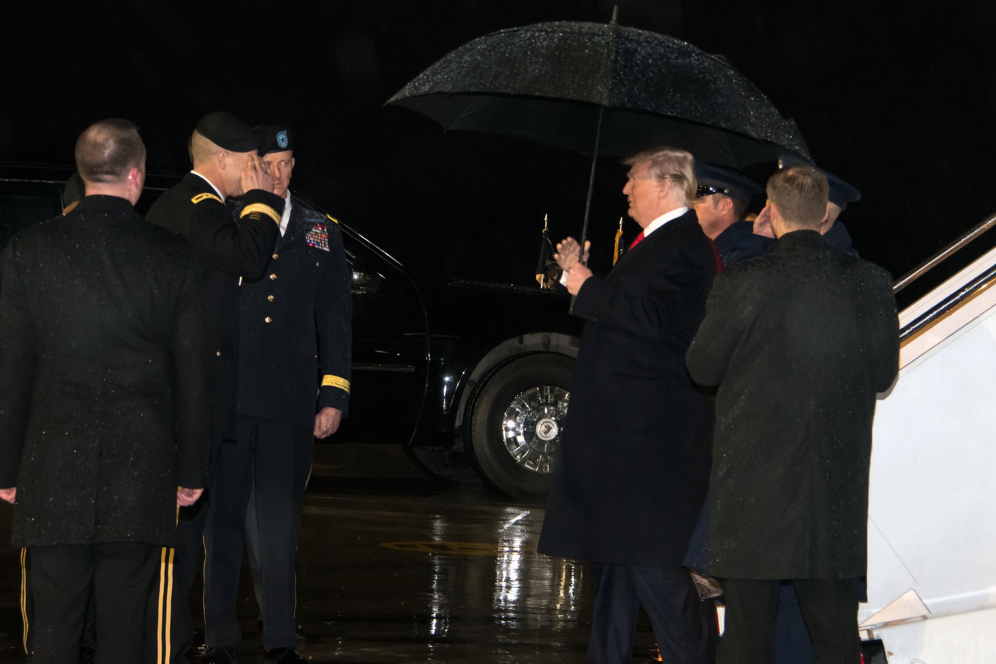 Maj. Gen. Joseph Jarrard, the adjutant general, Georgia Department of Defense, salutes President Donald Trump as he disembarks Air Force One at Dobbins Air Reserve Base, Ga., Jan. 8, 2018. The president later rode in a motorcade to the new Mercedes Benz stadium in Atlanta where he attended this year’s College Football Playoff National Championship game. (U.S. Air Force photo/Staff Sgt. Andrew Park)