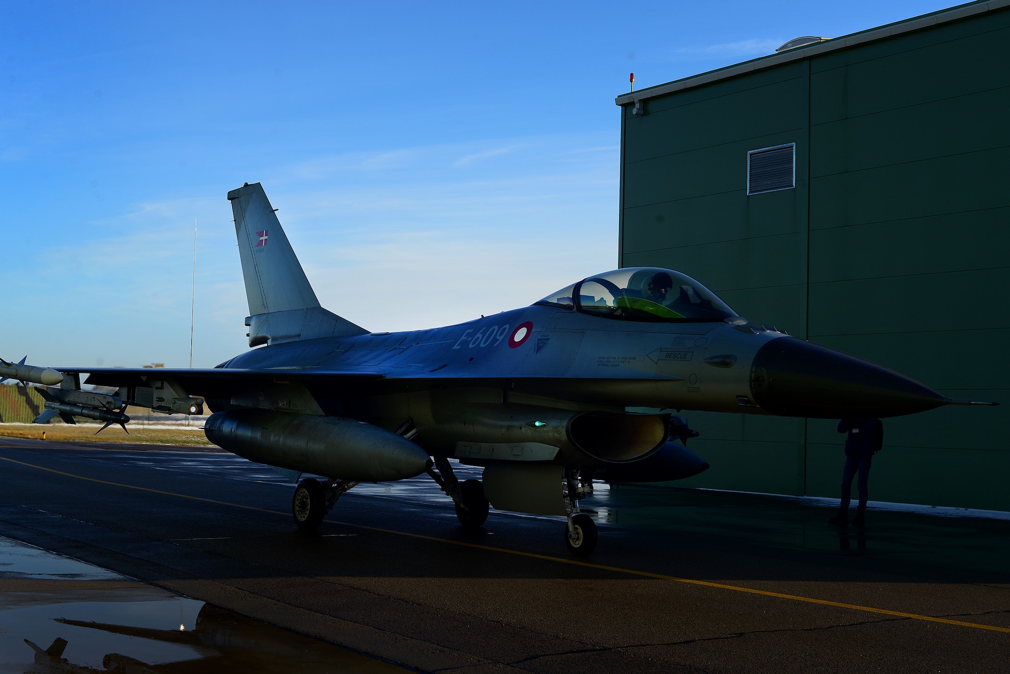 A Royal Danish F-16 pilot taxis to park after completion of a Baltic Air Policing sortie at Šiauliai Air Base, Lithuania, Jan. 8, 2018. NATO Air Policing is a peacetime collective defense mission, safeguarding the integrity of the NATO Alliance member’s airspace. (U.S. Air Force photo/ Tech. Sgt. Matthew Plew)