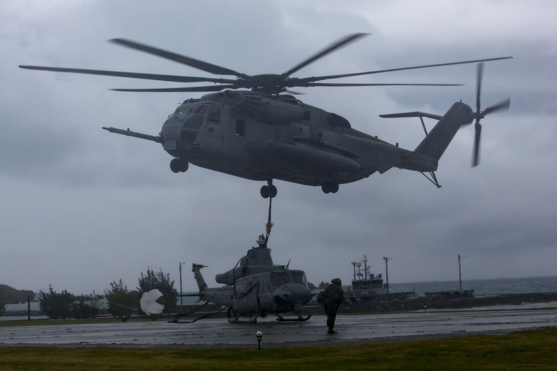 Marines with Heavy Marine Helicopter Squadron 466, externally lift a UH-1Y Venom, after it made a precautionary landing off a beach near Ikei-Jima, Japan, Jan. 8, 2018. January 7, the crew of a UH-1Y Venom landed on the beach after indications of the main rotor moving at too high a speed during a scheduled flight off the coast of Okinawa. During the incident, there were no injuries to personnel nor was there damage to properties. With all aircraft, thorough and consistent pilot training is the best way to ensure aviation safety, and the Marine Corps maintains that high standard without compromise. The Marine Corps rigorously investigates all aviation incidents to identify the causes, learn from them, and rectify the problems that occurred. Marine Light Attack Helicopter Squadron 369 and HMH-466 are currently deployed under the unit deployment program with Marine Aircraft Group 36, 1st Marine Aircraft Wing.
