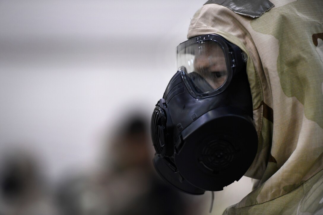 Air Force Staff Sgt. Jesse Grigg wears chemical protection gear.