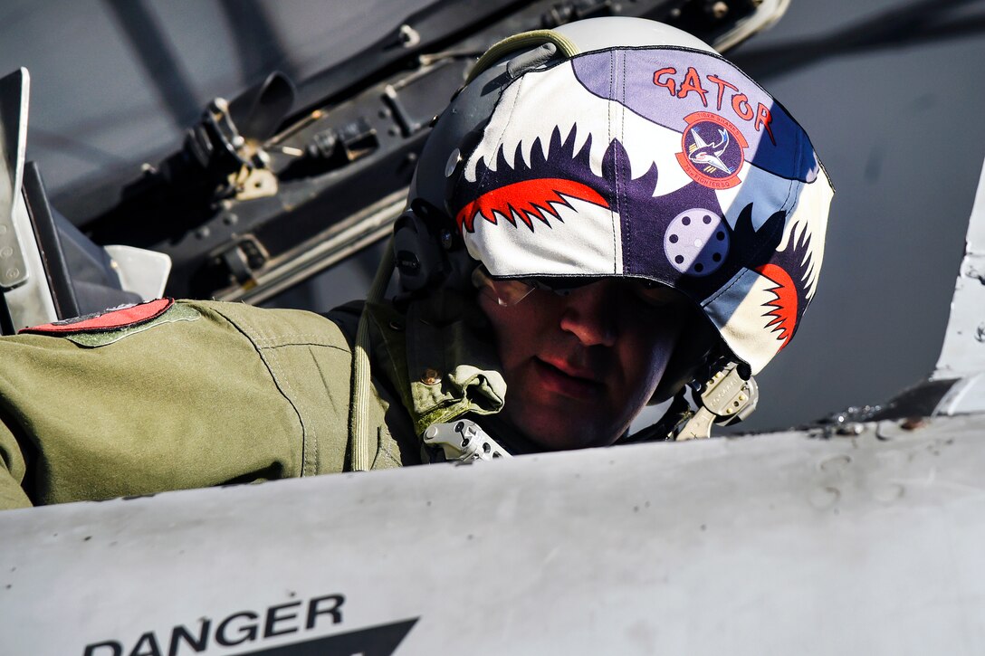 Air Force Capt. Haden Fullam makes final checks in his cockpit and before taking off on a mission.