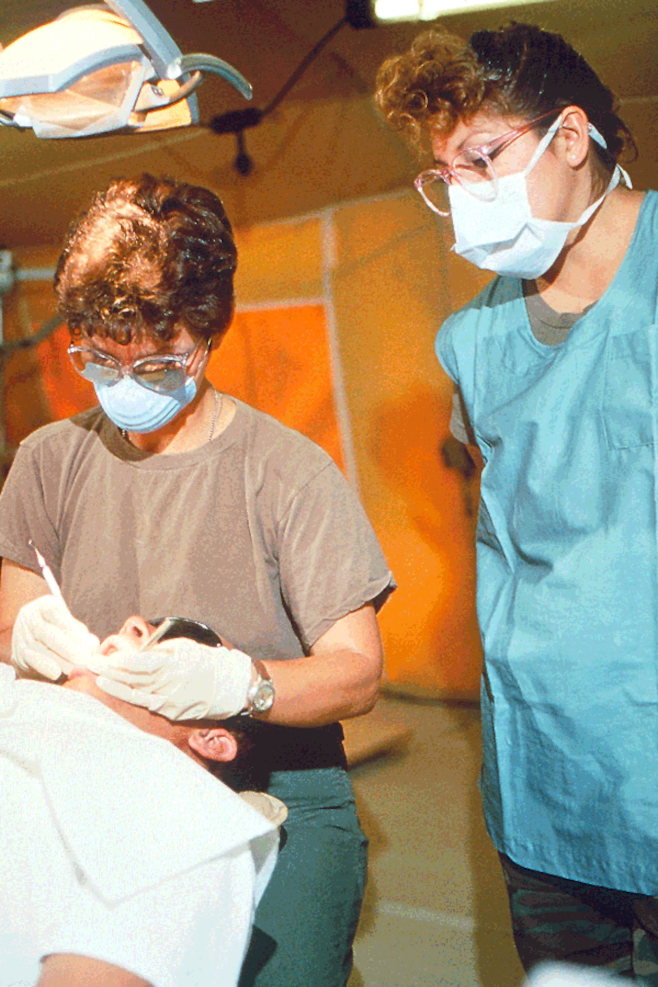 Dental technicians provide care at a field hospital during Operation Desert Shield.