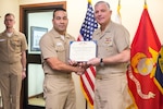 Navy Cdr. Allen “A.J.” Rivera is presented the Meritorious Service Medal for serving as director of Operations Research and Analysis Division at Naval Supply Systems Command, Weapon Systems Support in Mechanicsburg, Pennsylvania, in a ceremony on Jan. 4.