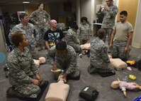 U.S. Air Force Airmen listen to the Basic Life Support instructors during a 633rd Medical Group Education and Training Center training at Joint Base Langley-Eustis, Va., Dec. 6, 2017.