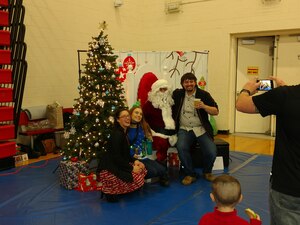 Celebrating with Santa at the Holiday party. December 8, 2017
