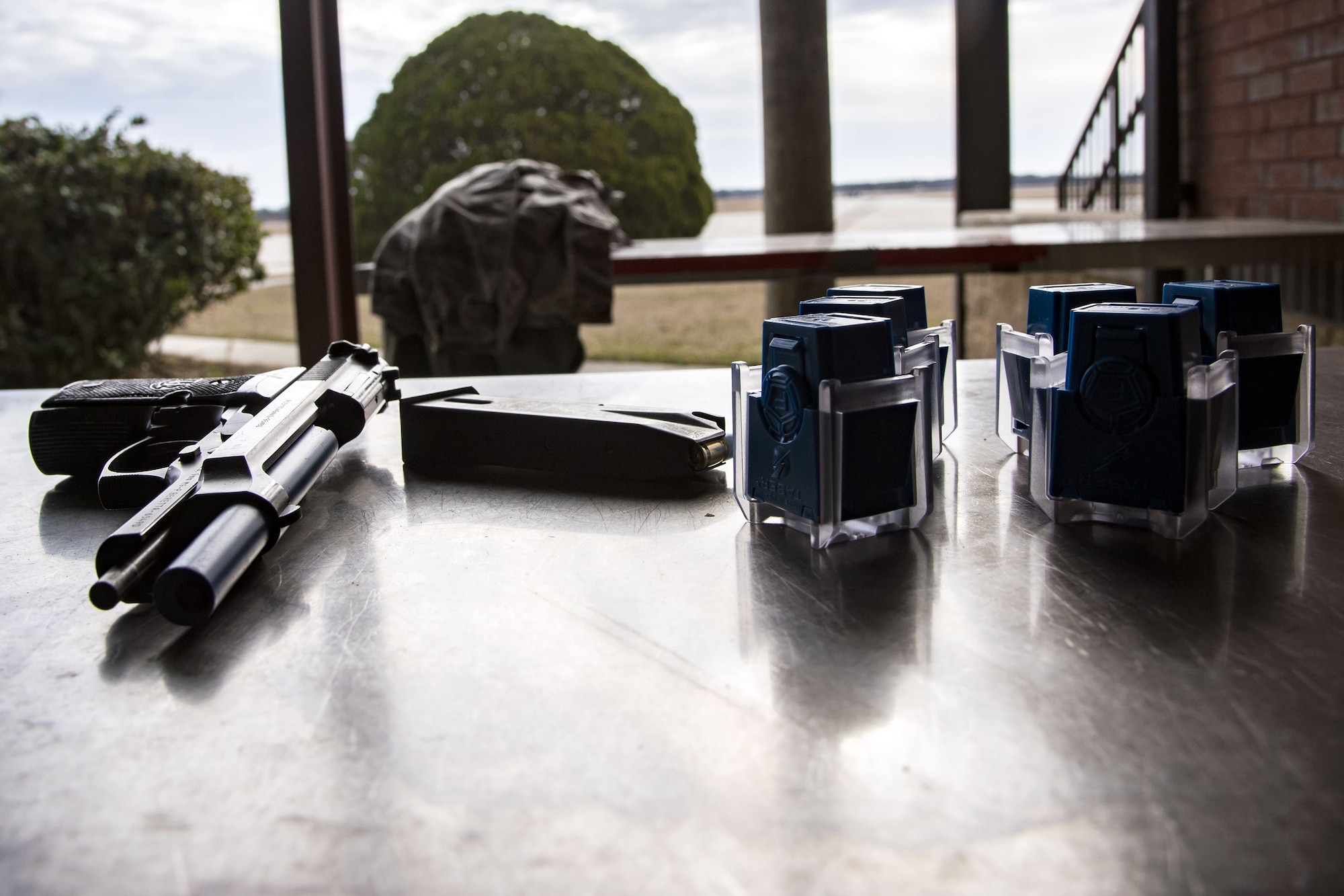 A 9 mm handgun and ammunition rests on a table, Jan. 8, 2018, at Moody Air Force Base, Ga. The 23d SFS held a “shoot, don’t shoot, engage” training scenario to help prepare their Airmen on how to handle situations in which they have to fire their weapon or simply talk to someone. (U.S. Air Force photo by Airman Eugene Oliver)