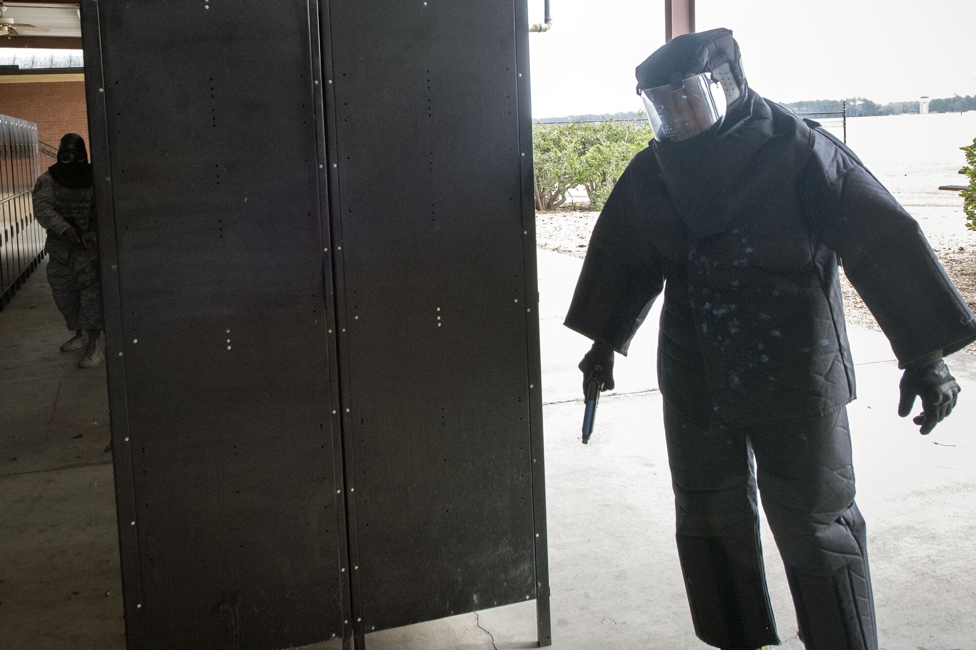 Senior Airman Brandon Miles, right, 23d Security Forces Squadron (SFS) unit trainer, prepares to engage in a firefight with Tech. Sgt. Eddie Ingram III, 23d SFS flight sergeant, Jan. 8, 2018, at Moody Air Force Base, Ga. The 23d SFS held a “shoot, don’t shoot, engage” training scenario to help prepare their Airmen on how to handle situations in which they have to fire their weapon or simply talk to someone. (U.S. Air Force photo by Airman Eugene Oliver)