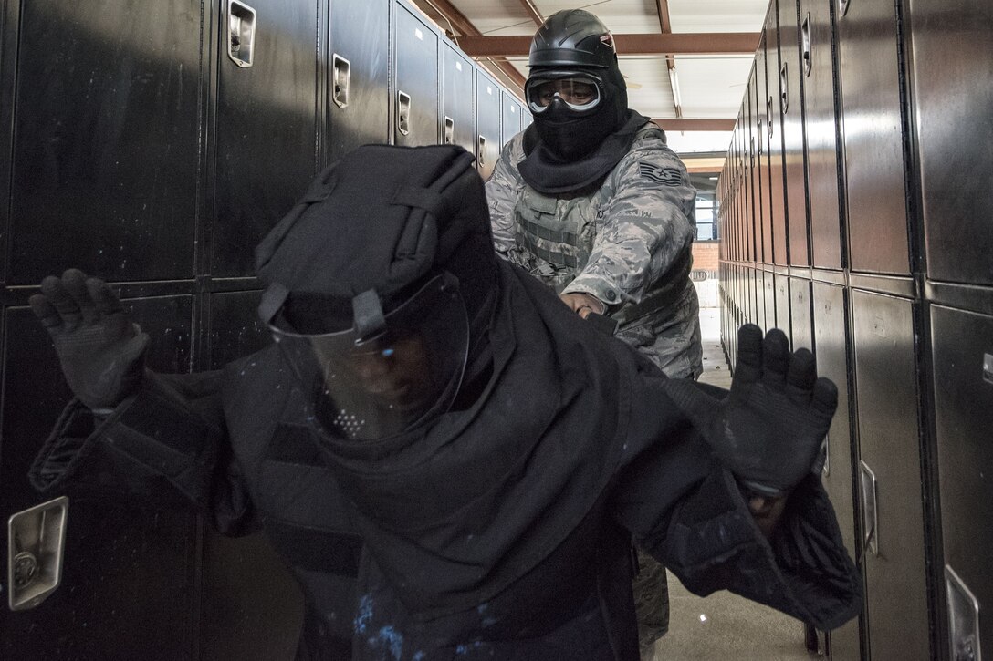 Tech. Sgt. Eddie Ingram III, 23d Security Forces Squadron (SFS) flight sergeant, right, apprehends Senior Airman Brandon Miles, 23d SFS unit trainer, Jan. 8, 2018, at Moody Air Force Base, Ga. The 23d SFS held a “shoot, don’t shoot, engage” training scenario to help prepare their Airmen on how to handle situations in which they have to fire their weapon or simply talk to someone. (U.S. Air Force photo by Airman Eugene Oliver)