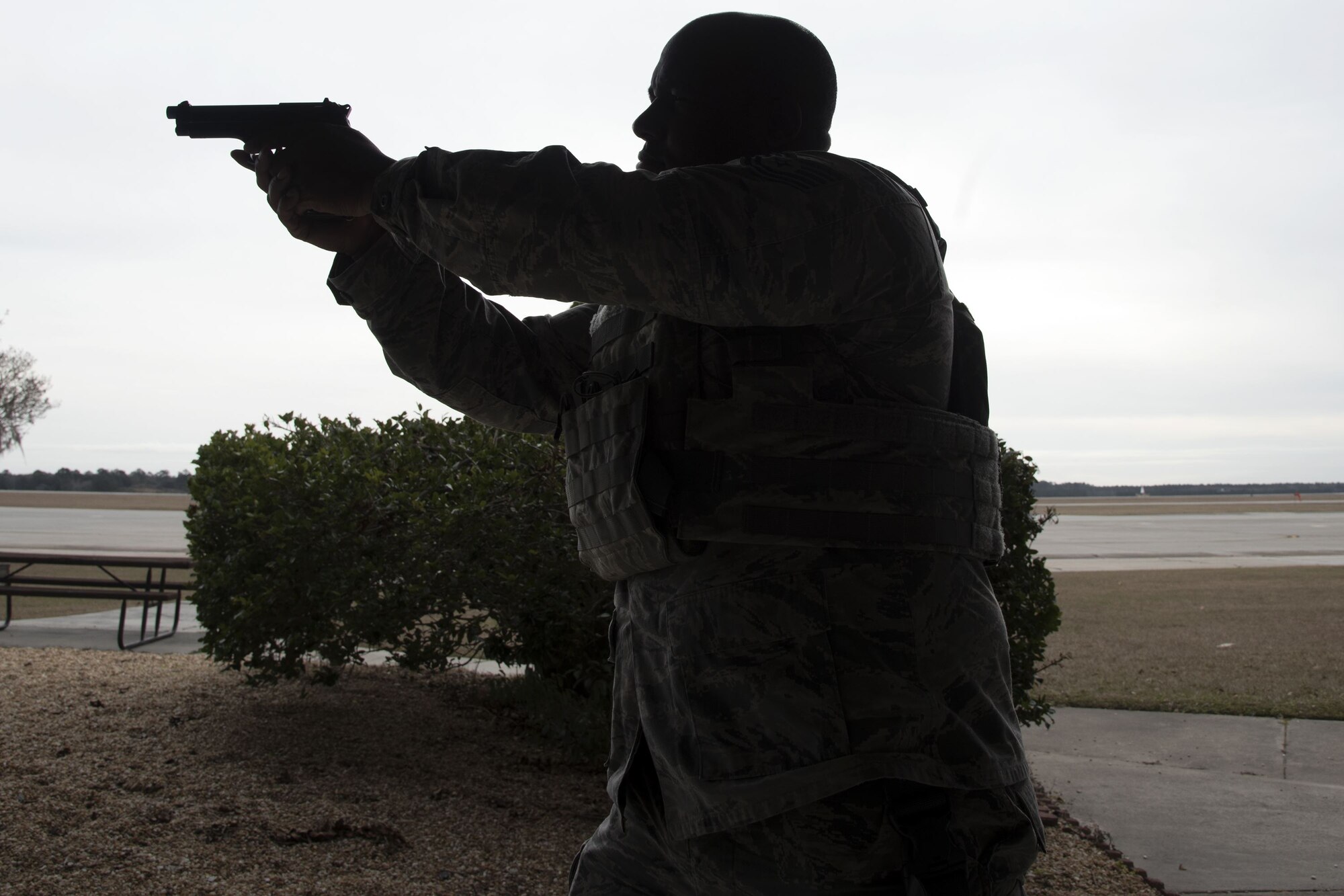 Tech. Sgt. Eddie Ingram III, 23d Security Forces Squadron (SFS) flight sergeant, aims down the sights of his 9 mm handgun, Jan. 8, 2018, at Moody Air Force Base, Ga. The 23d SFS held a “shoot, don’t shoot, engage” training scenario to help prepare their Airmen on how to handle situations in which they have to fire their weapon or simply talk to someone. (U.S. Air Force photo by Airman Eugene Oliver)