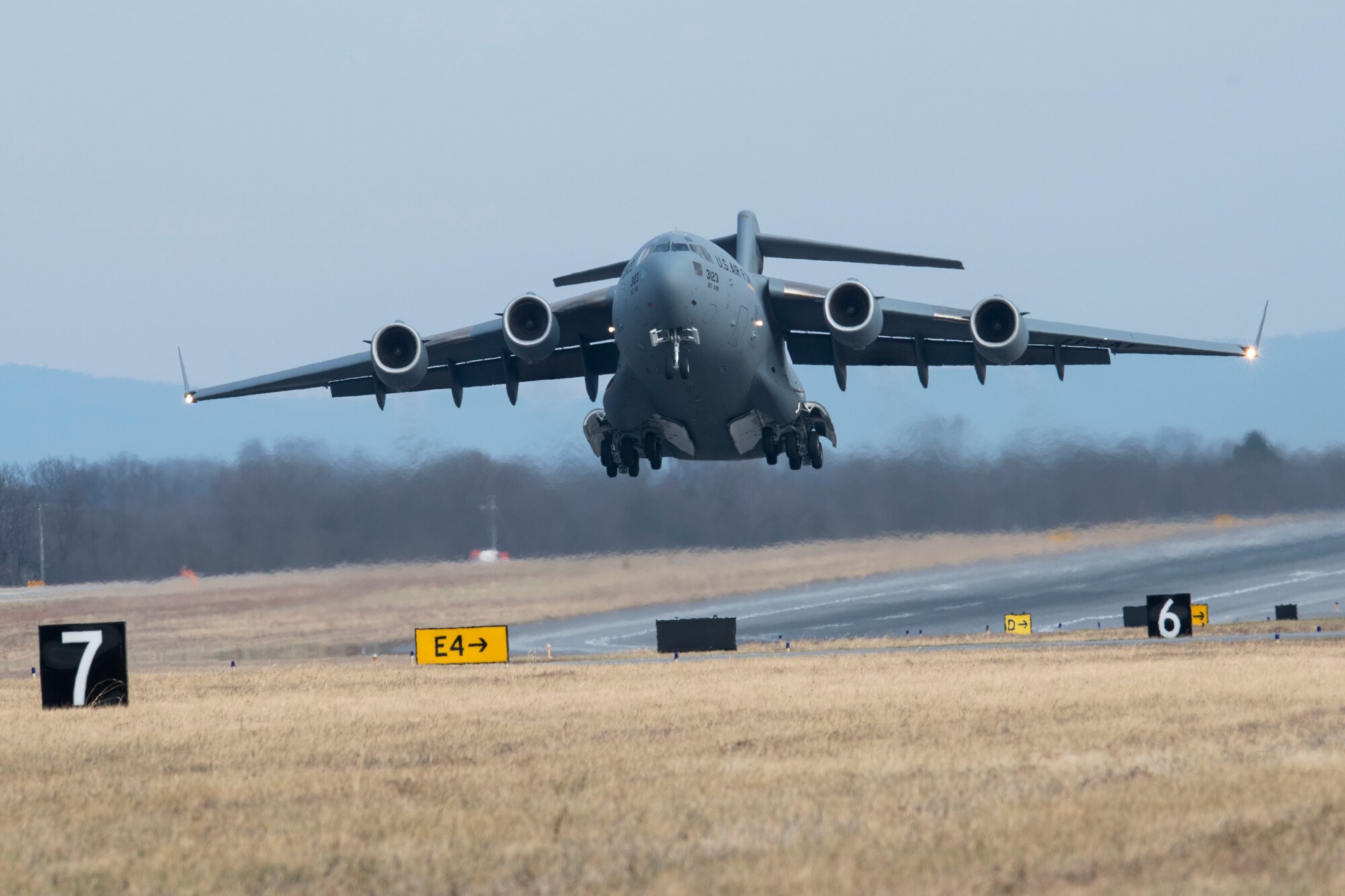 A C-17 Globemaster III aircraft takes off for a training flight from Shepherd Field, Martinsburg, W.Va., Dec 20. Aircrews fly routine training missions in addition to numerous Guard and Tanker Airlift Control Center missions each month. (U.S. Air National Guard photo by Senior Master Sgt. Emily Beightol-Deyerle)