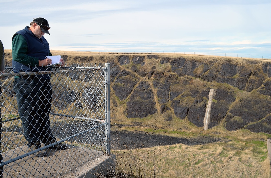 Geotechnical Engineer Ken Pattermann takes notes regarding the Black Butte Dam spillway while participating in an annual inspection with the U.S. Army Corps of Engineers Sacramento District on Nov. 30, 2017.