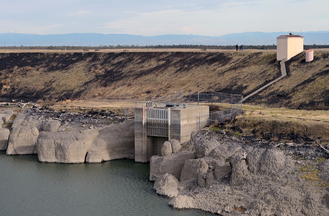 Geotechnical Engineer Ken Pattermann and Philip “Junior” Golia walk along the top of the 2,970-foot Black Butte Dam as part of an annual inspection by U.S. Army Corps of Engineers Sacramento District.