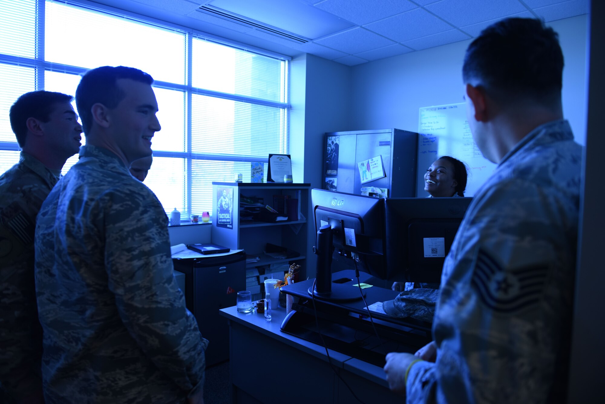 U.S. Air Force 2nd Lt. Nathan Closen, tactical air control party specialist assigned to the 118th Air Support Operations Squadron (ASOS), introduces Chase Riddell, student from East Mecklenburg High School, to other members of the 118th ASOS during a visit Dec. 04, 2017. Riddell, with the junior reserves officer training corps (J.R.O.T.C.), reached out to the North Carolina Air National Guard to shadow a guardsmen as his senior project. Closen gave Riddell a tour of their facility, and equipment including a unique simulation room. (U.S. Air National Guard photo by Staff. Sgt. Laura J. Montgomery)