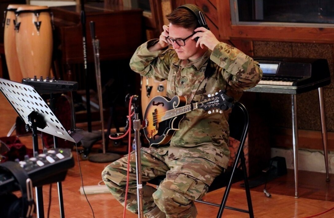 Army Spc. Trenton Frizzell from the Army Materiel Command Band gears up for the recording session at Fame Studios in Muscle Shoals, Ala.