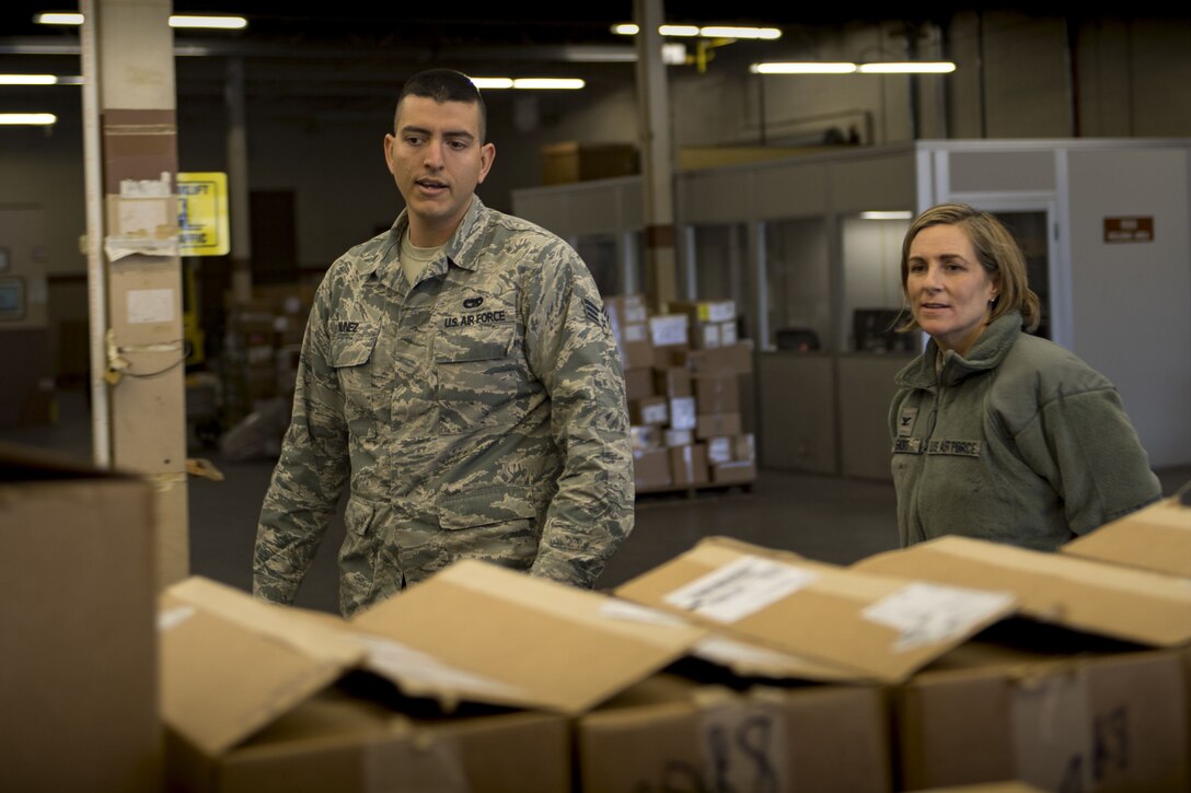 Senior Airman Michael Nunez, 23d Logistics Readiness Squadron transit management inbound specialist, demonstrates his day-to-day duties to Col. Jennifer Short, 23d Wing commander, Jan. 8, 2018, at Moody Air Force Base, Ga. Short’s immersion allowed her to see the processes aircraft parts go through from the time they arrive at Moody to when they’re placed on the aircraft. (U.S. Air Force photo by Senior Airman Daniel Snider)