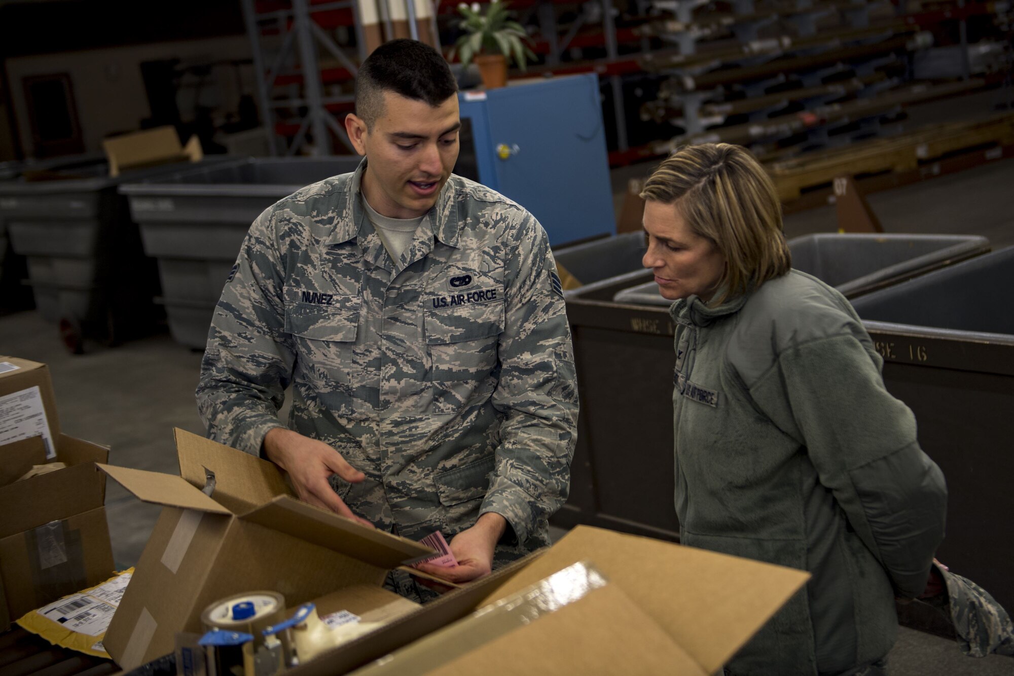 Senior Airman Michael Nunez, 23d Logistics Readiness Squadron transit management inbound specialist, demonstrates his day-to-day duties to Col. Jennifer Short, 23d Wing commander, Jan. 8, 2018, at Moody Air Force Base, Ga. Short’s immersion allowed her to see the processes aircraft parts go through from the time they arrive at Moody to when they’re placed on the aircraft. (U.S. Air Force photo by Senior Airman Daniel Snider)