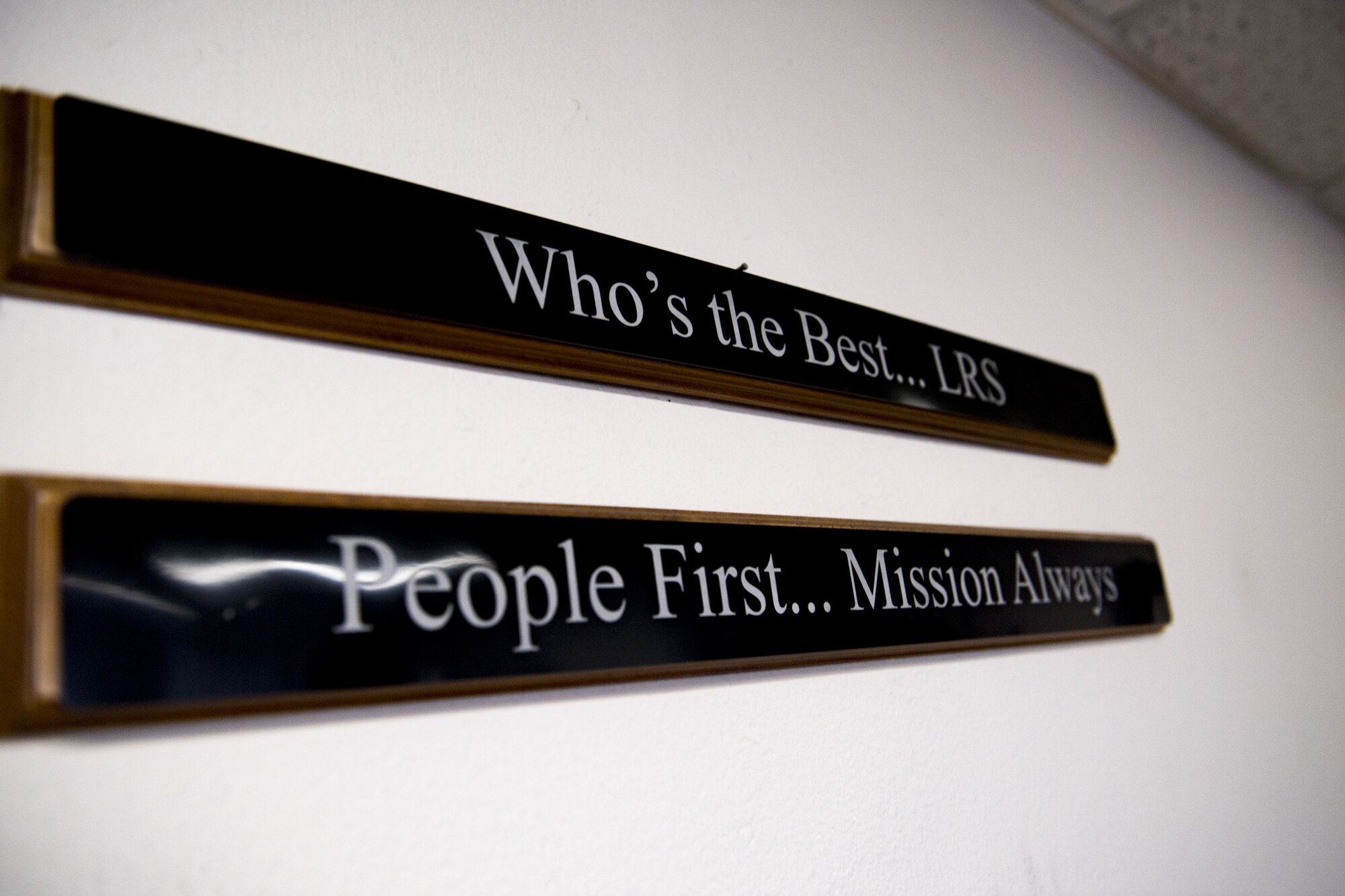 Signs hang from a wall within the 75th Aircraft Maintenance Unit parts checkout section, Jan. 8, 2018, at Moody Air Force Base, Ga. Short’s immersion allowed her to see the processes aircraft parts go through from the time they arrive at Moody to when they’re placed on the aircraft. (U.S. Air Force photo by Senior Airman Daniel Snider)
