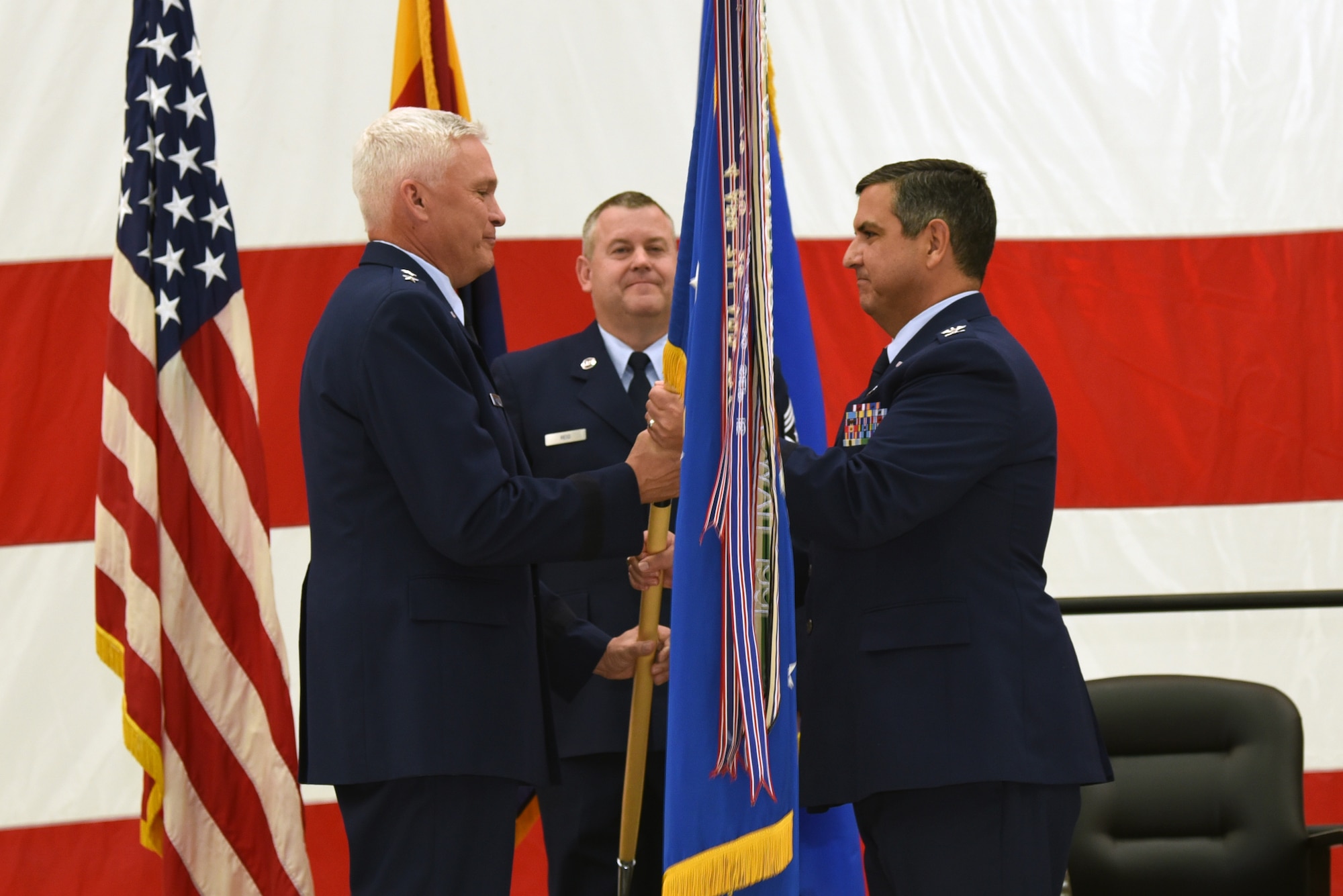 Col. Patrick W. Donaldson accepts the 161st Air Refueling Wing guidon from Maj. Gen. Edward Maxwell, Arizona Air National Guard Air Component Commander,  during the change of command ceremony at Goldwater Air National Guard Base, Jan. 7, 2017.
