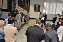 Col. Raymond Briggs, pictured in center left, welcomes the Bridge to the Future participants to Arnold Air Force Base. The event, for college-aged students of AEDC team members, was held Dec. 18 at Arnold to give prospective AEDC team members a chance to learn about the Complex and the career opportunities available. (U.S. Air Force photo/Rick Goodfriend)