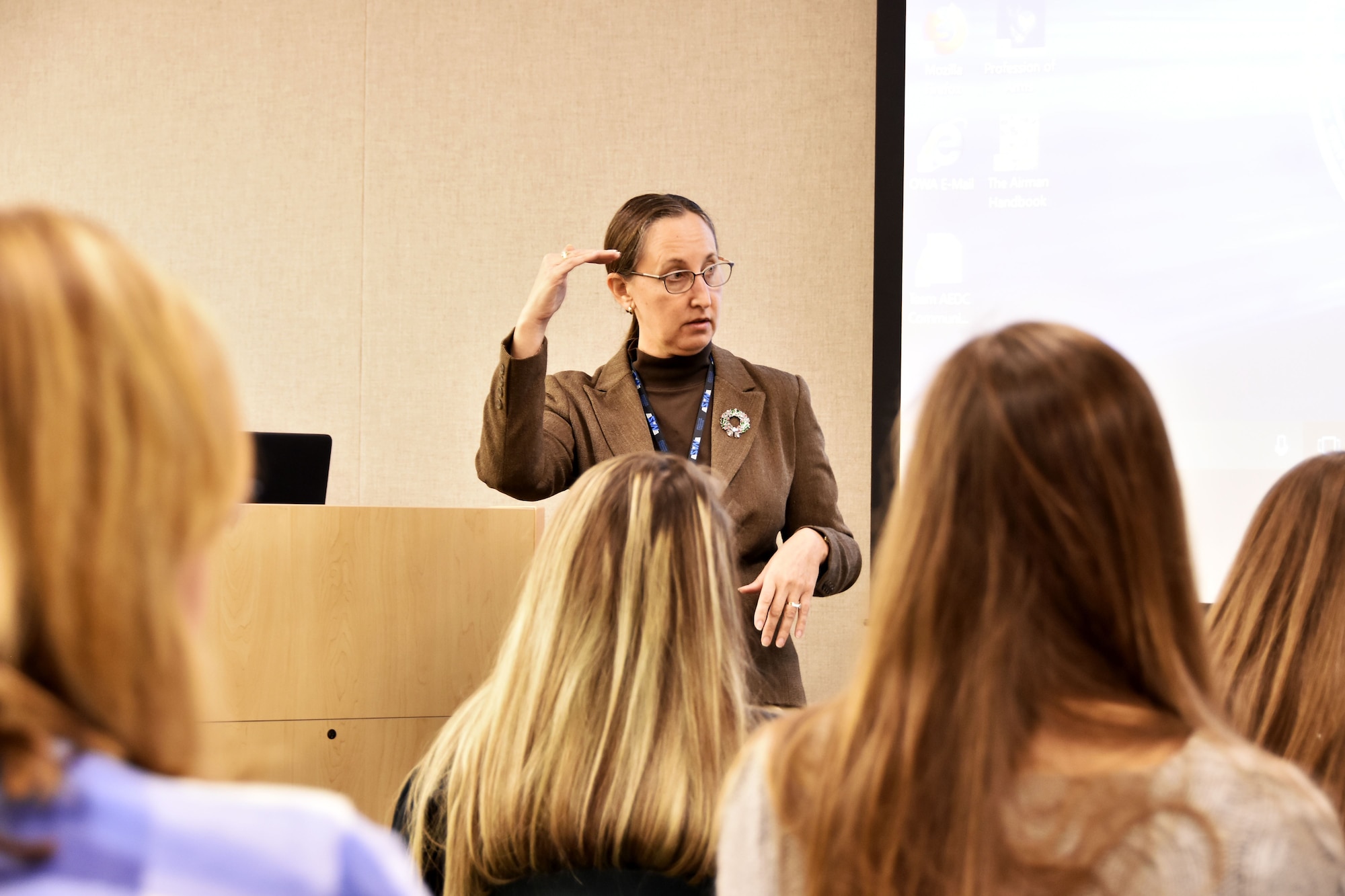 Cynthia Rivera, general manager of National Aerospace Solutions, AEDC Test Operations and Sustainment contractor, speaks to the participants of the Bridge to the Future event at Arnold Air Force Base. The event Dec. 18 provided college-age students of AEDC team members the chance to see where their family works and learn about the many career opportunities available. (U.S. Air Force photo/Rick Goodfriend)