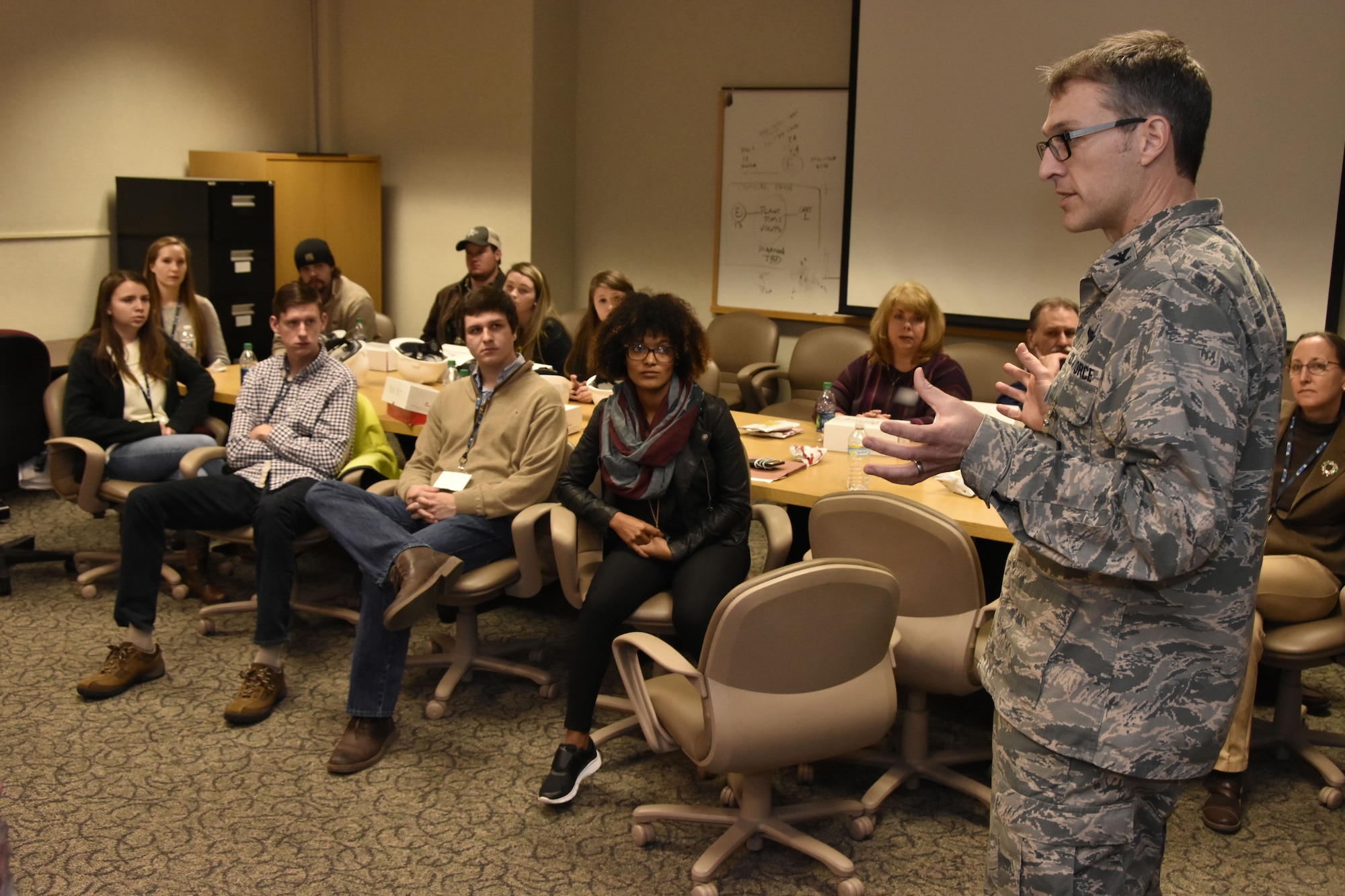 AEDC Commander Col. Scott Cain tells Bridge to the Future participants and mentors about his time as an Air Force pilot and how the work at AEDC is important to the warfighter. The Bridge to the Future event Dec. 18 at Arnold Air Force Base provided college-age students of AEDC team members the chance to see where their family works and learn about the many career opportunities available. (U.S. Air Force photo/Rick Goodfriend)