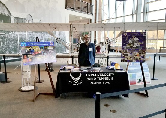 Dr. Eric Marineau, chief scientist of hypersonics at the AEDC Hypervelocity Wind Tunnel 9, hosts a booth at a recent Science, Technology, Engineering and Mathematics event held at the Aviation Museum in College Park, Maryland. While there, Marineau had the opportunity to speak with students of Duvall High School about his work and the many careers in aerospace engineering. (U.S. Air Force photo/Dan Marren)