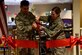 U.S. Air Force Col. Ricky Mills, 17th Training Wing commander, and Col. Julie Newlin, Air Force Services Activity director of operations, cut the ribbon officially opening the Western Winds Dining Facility on Goodfellow Air Force Base, Texas, Jan. 8, 2018. This marked a conclusion of 3 years work and $5.3 million in renovations. (U.S. Air Force photo by Airman 1st Class Seraiah Hines/Released)