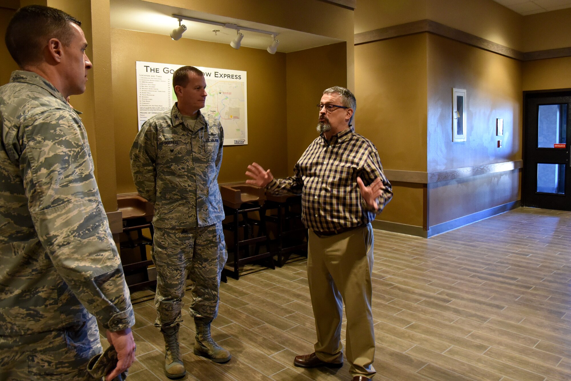 U.S. Air Force Col. Jason Beck, 17th Mission Support Group commander, and Col. Jeffrey Sorrell, 17th Training Wing vice commander, listen as Chief of Food Operations for Goodfellow David Minard, gives a tour explaining the improvements made to the Western Winds Dining Facility at Goodfellow Air Force Base, Texas, Jan. 8, 2018. Some of the improvements made included more open space and seating for more customers. (U.S. Air Force photo by Airman 1st Class Seraiah Hines/Released)