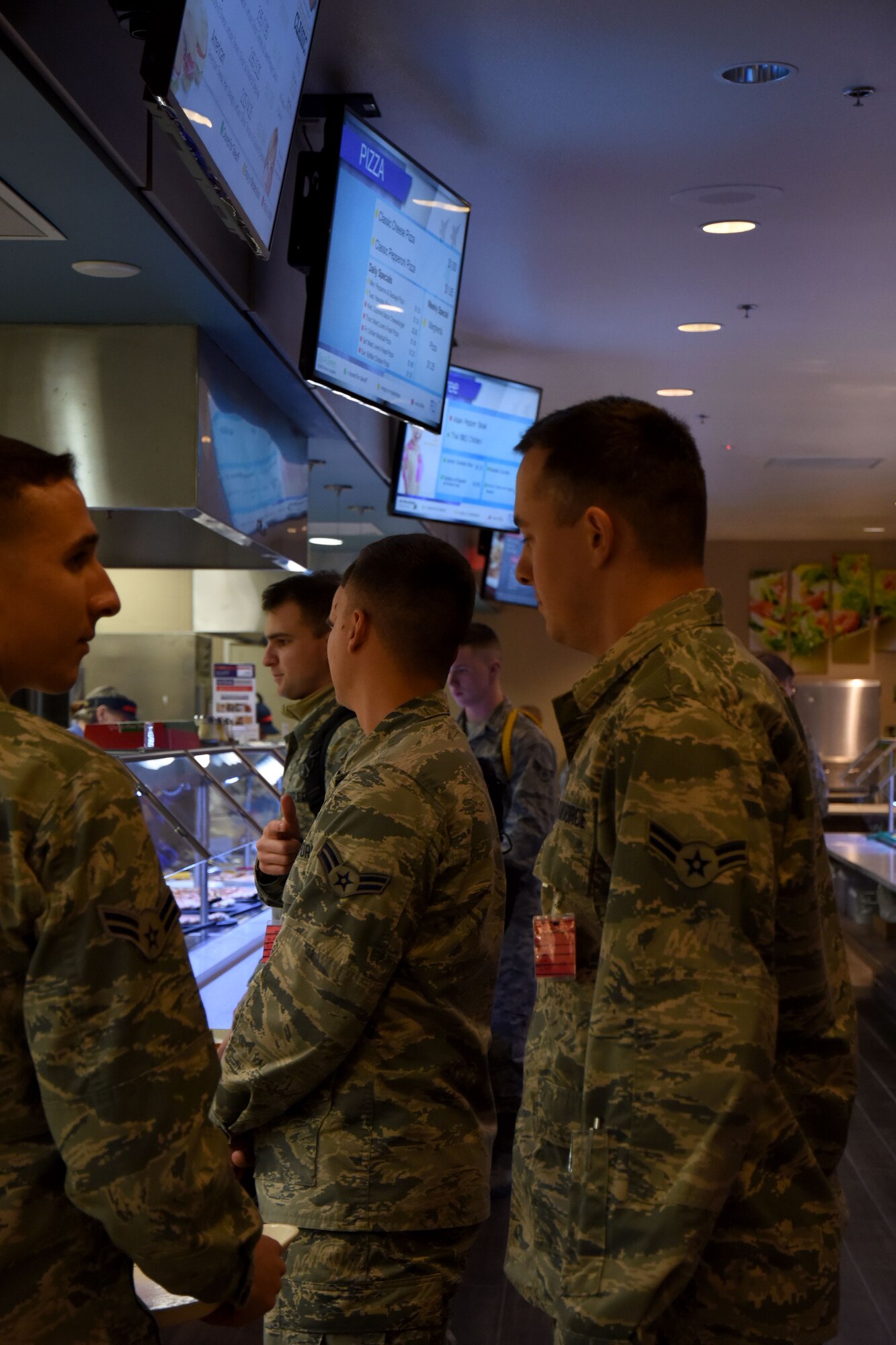Diners take advantage of the new Western Winds Dining Facility stations at Goodfellow Air Force Base, Texas, Jan. 8, 2018. The stations include a grill where they can make a variety of options to the customer's liking, a salad bar, sub-sandwich station, and pizza by-the-slice. (U.S. Air Force photo by Airman 1st Class Seraiah Hines/Released)