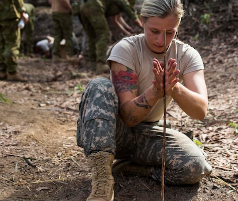 U.S. Army soldier 2nd Lt. Shelby Blad attempts to start a fire in the Northern Territory, Australia, August 30, 2016. Participants will learn survival skills during Exercise Kowari, an exercise to enhance the United States, Australia, and China’s friendship and trust, through trilateral cooperation in the Indo-Asia-Pacific region. (U.S. Marine Corps photo by Lance Cpl. Osvaldo L. Ortega III/Released)