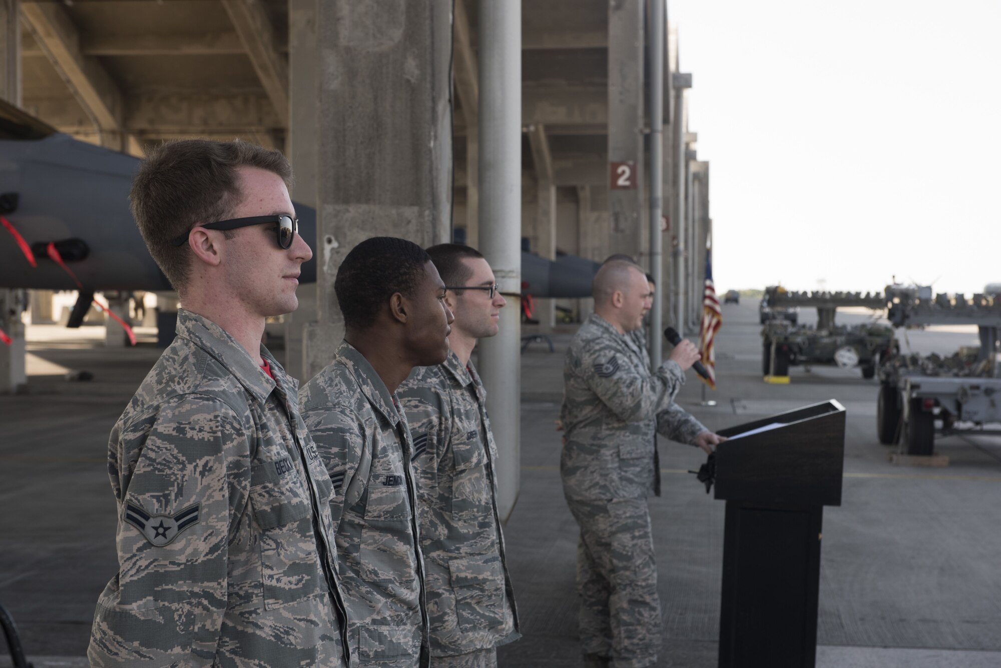 U.S. Air Force Tech. Sgt. Benjamin Bouvy, right, 18th Maintenance Group load standardization crew chief, introduces Airmen from the 67th Aircraft Maintenance Unit before an annual weapons load competition Jan. 3, 2018, on Kadena Air Base, Japan. Airmen from the 67th AMU competed against Airmen from the 44th AMU. (U.S. Air Force photo by Staff Sgt. Micaiah Anthony)