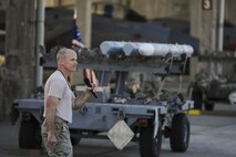U.S. Air Force Chief Master Sgt. Daniel Taylor, 18th Maintenance Group superintendent, gives a victory speech after the Chiefs versus Eagles Weapons Load Competition Jan. 3, 2018, on Kadena Air Base, Japan. The competition pitted a team of chief master sergeants against a team of colonels on who could prepare the aircraft for combat the fastest with the fewest procedural errors. (U.S. Air Force photo by Staff Sgt. Micaiah Anthony)