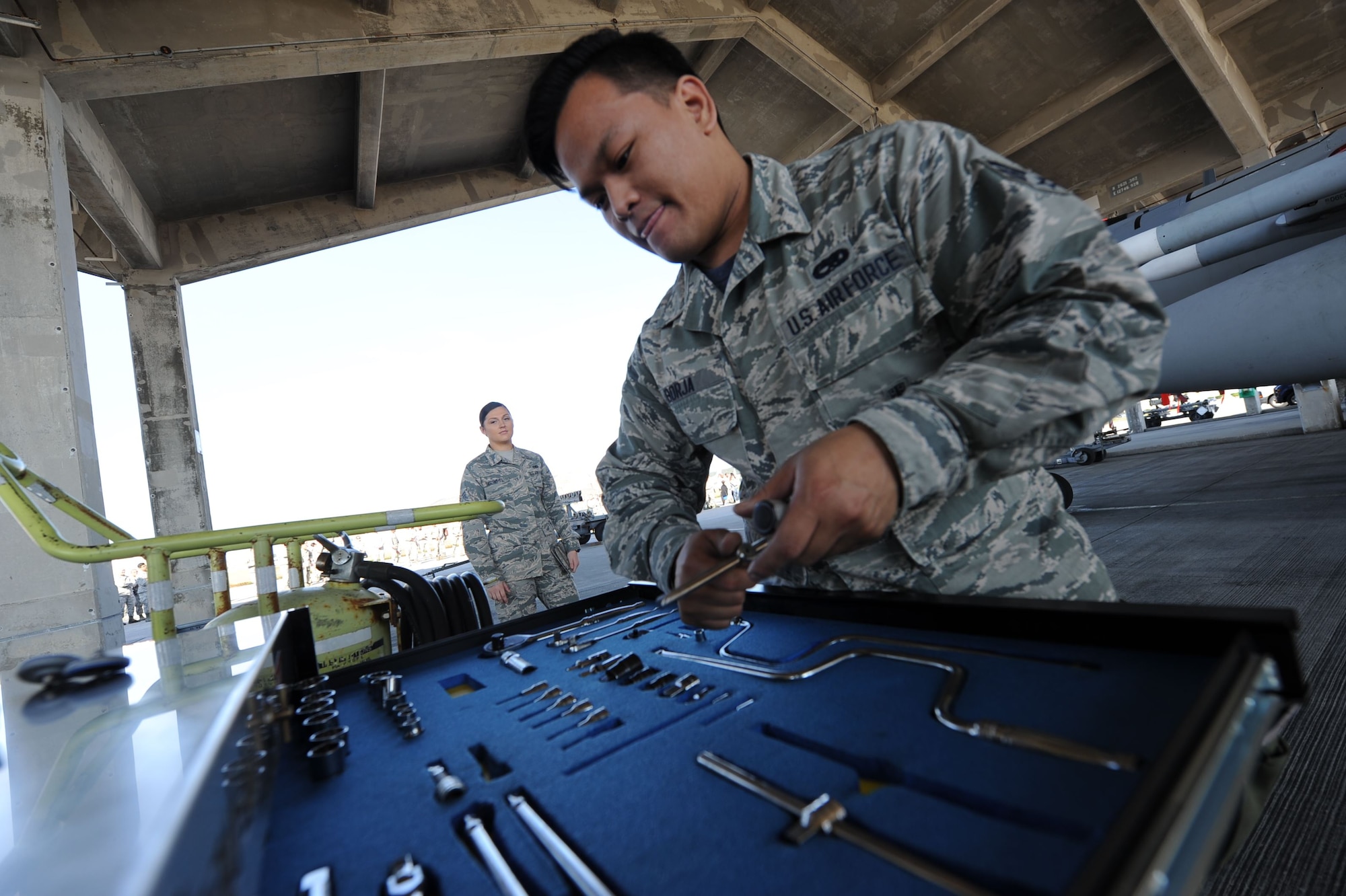 U.S. Air Force Senior Airman Melchorcrispin Borja, 44th Aircraft Maintenance Unit weapons load team member, inspects a tool box during an annual weapons load competition Jan. 3, 2018, on Kadena Air Base, Japan. Once the missiles are loaded, teams must ensure all tools are accounted for. (U.S. Air Force photo by Staff Sgt. Micaiah Anthony)