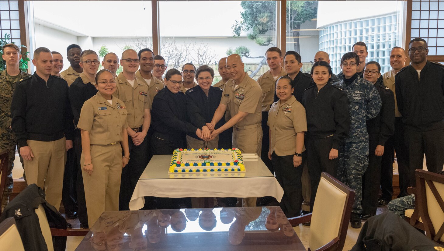 Chief of Chaplains Rear Adm. Margaret G. Kibben talks to Sailors and officers, part of religious ministry team in the region at Commander Fleet Activities Yokosuka, Jan. 8. While visiting the forward deployed naval forces, Kibben celebrated the 39th birthday for the religious program specialist rate.