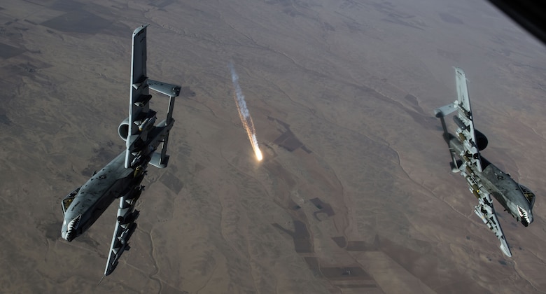 An A-10 Thunderbolt II refuels from a KC-135 Stratotanker.