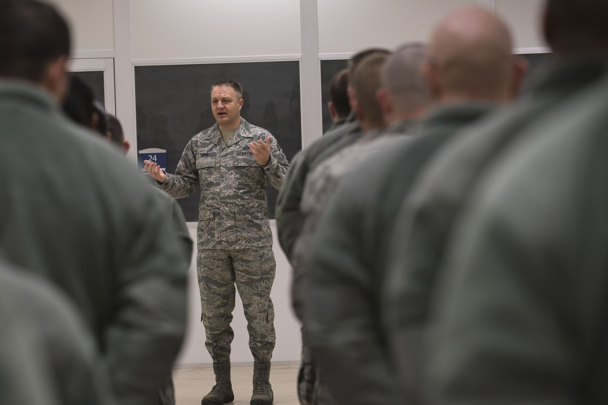 Chief Master Sgt. James W. Loper, 10th Air Force command chief master sergeant, addresses members of the 476th Fighter Group, Jan. 6th, at Moody Air Force Base, Ga. The 10th Air Force leadership visited Moody to discuss the future deployments and changes to their units. (U.S. Air Force photo by Senior Airman Daniel Snider)