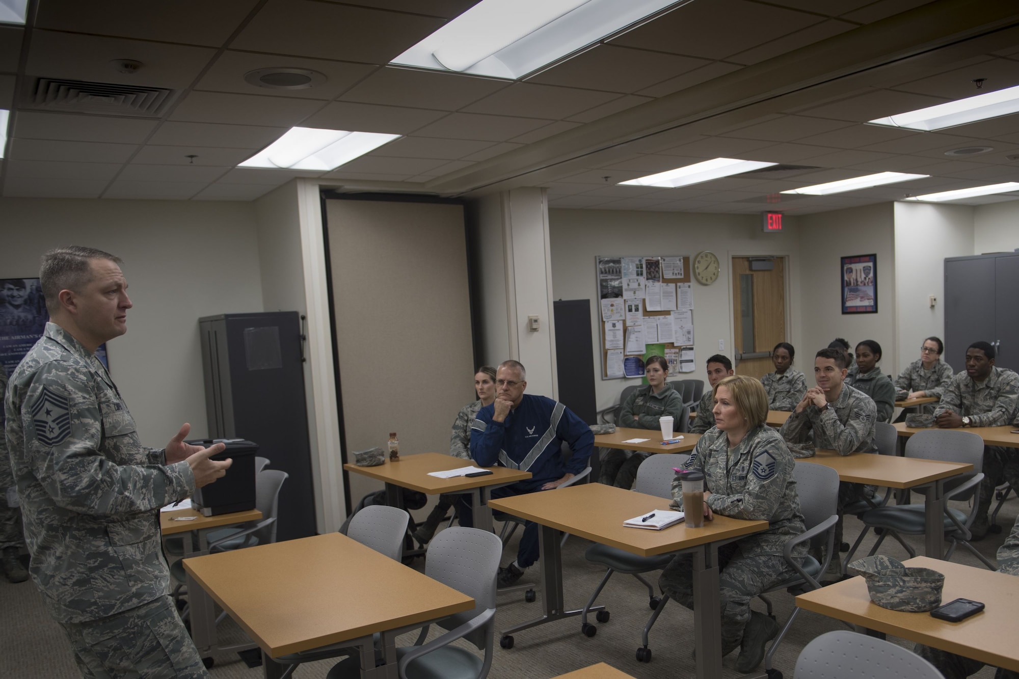 Chief Master Sgt. James W. Loper, 10th Air Force command chief master sergeant, answers questions from Airmen assigned to the 476th Aeromedical Medicine Flight, Jan. 7th, at Moody Air Force Base, Ga. The 10th Air Force leadership visited Moody to discuss the future deployments and changes to their units. (U.S. Air Force photo by Senior Airman Daniel Snider)