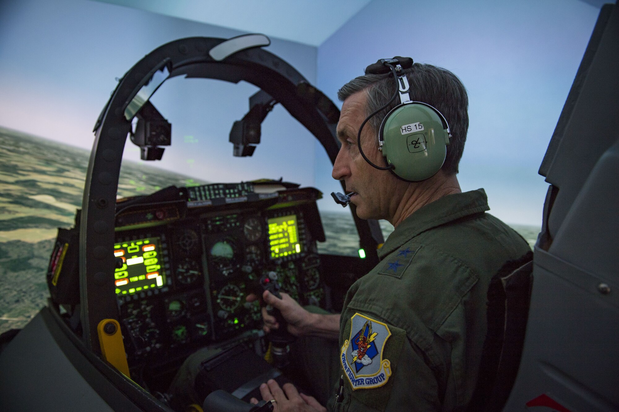 Maj. General Ronald Bruce Miller, 10th Air Force commander, looks to the side as he flies an A-10C Thunderbolt II during a simulated flight, Jan. 8, 2018, at Moody Air Force Base, Ga. The 10th Air Force leadership visited Moody to discuss the future deployments and changes to their units. (U.S. Air Force photo by Senior Airman Janiqua P. Robinson)